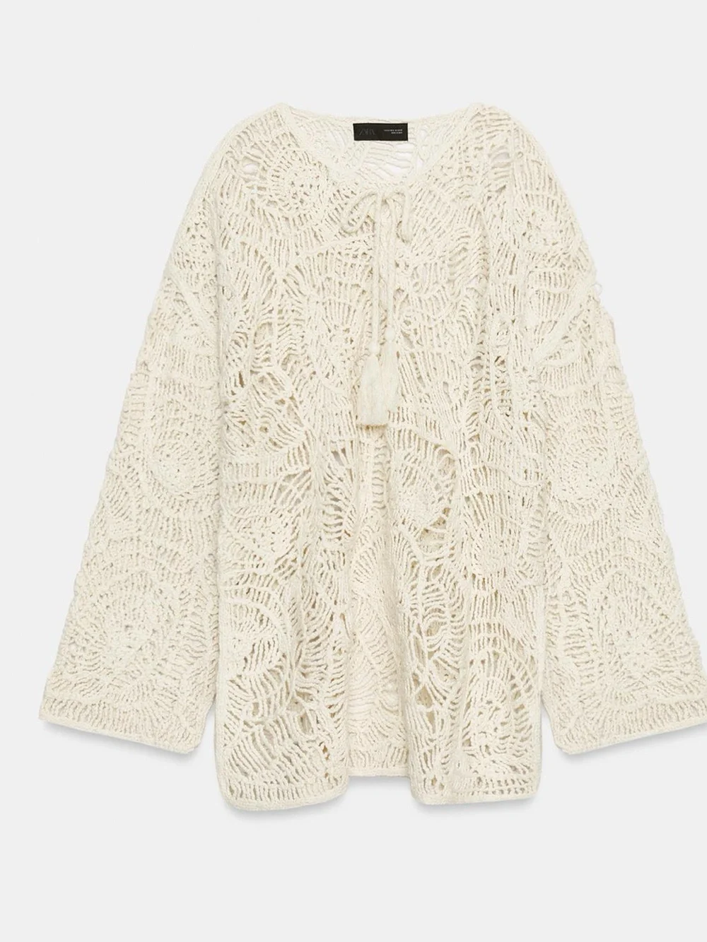 Zara Open-Knit Tassel Dress in Ecru features a distinct crochet pattern